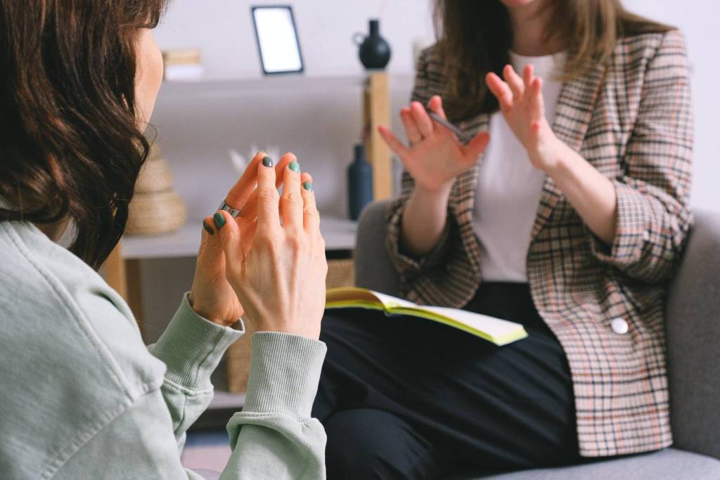 two women with hands up